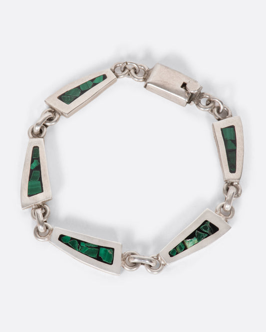 A sterling silver chain bracelet with long, trapezoidal links, lined with malachite inlay.
