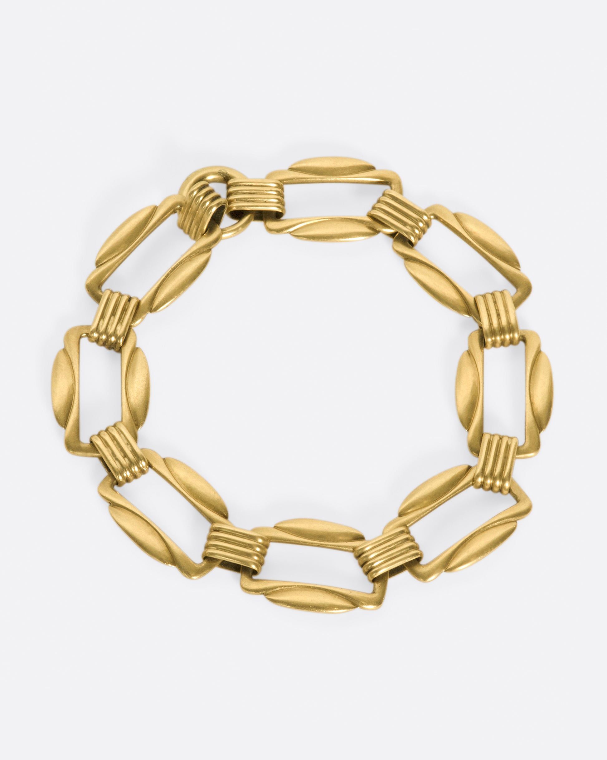 The clasp on this bracelet is hidden amongst its architectural links.