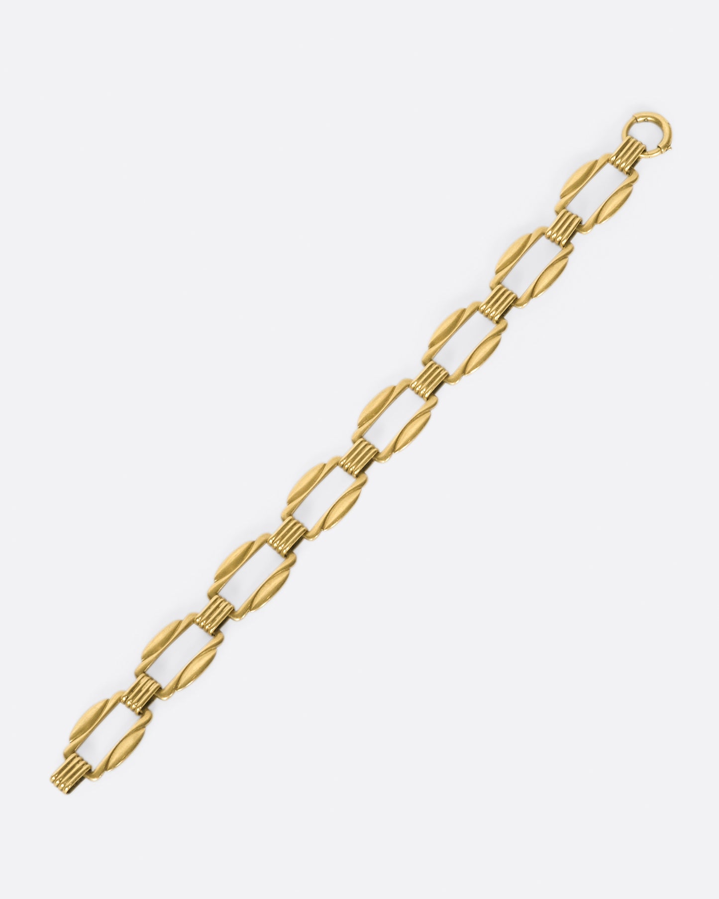 The clasp on this bracelet is hidden amongst its architectural links.