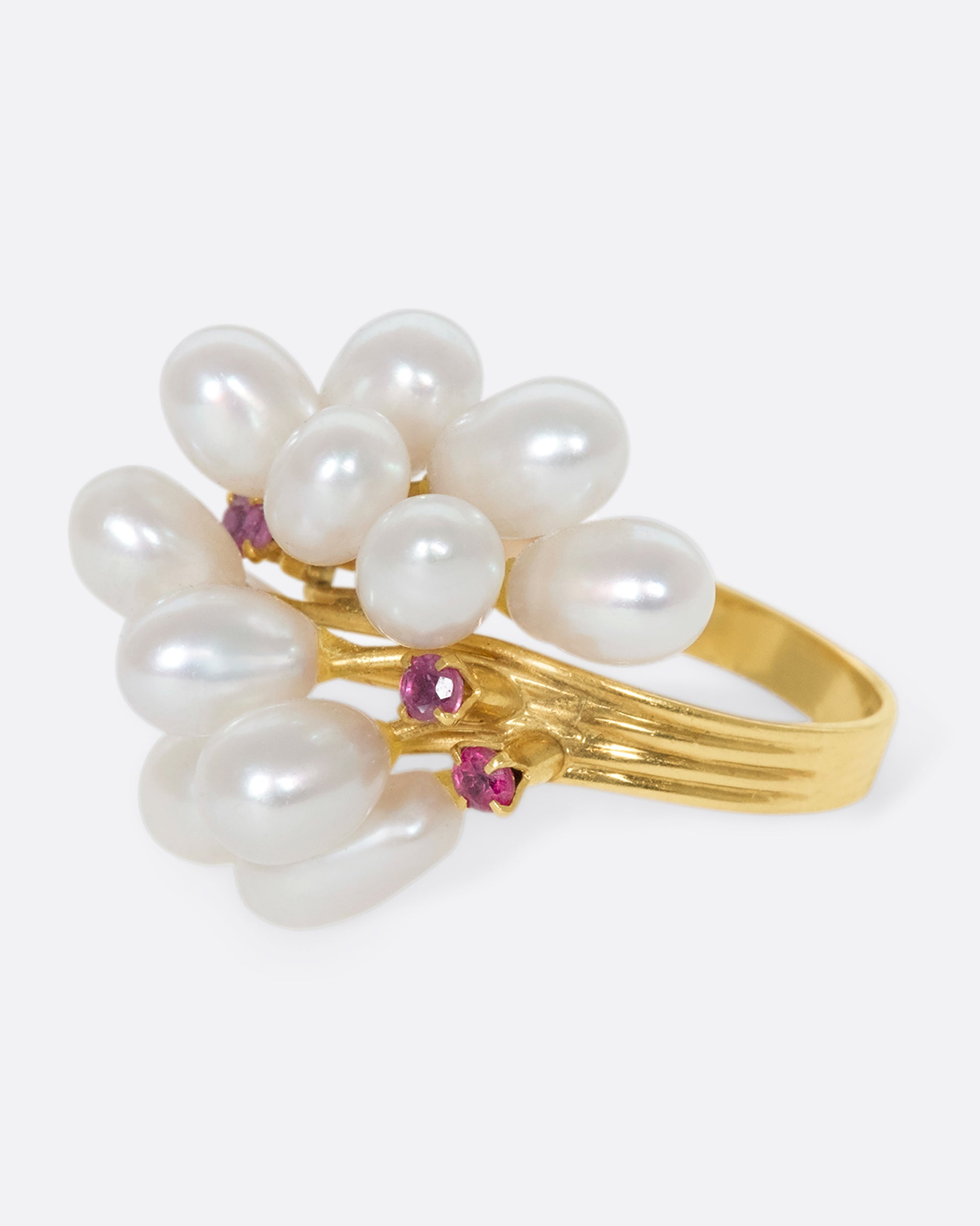 A 14k gold and pearl pussy willow ring with pink sapphire accents