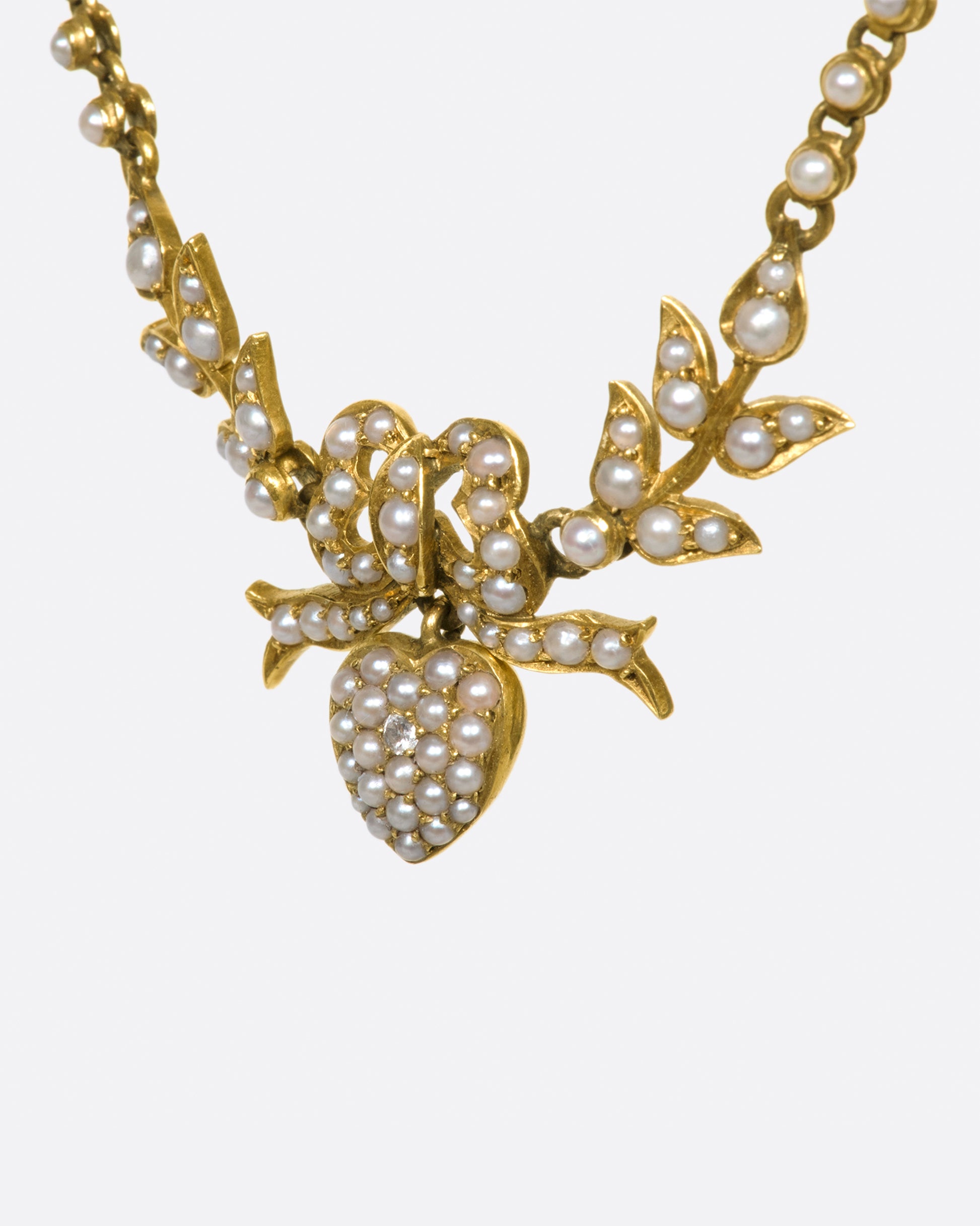 An English, 15k gold, belle epoque, turn of the century festoon necklace with natural seed pearls.
