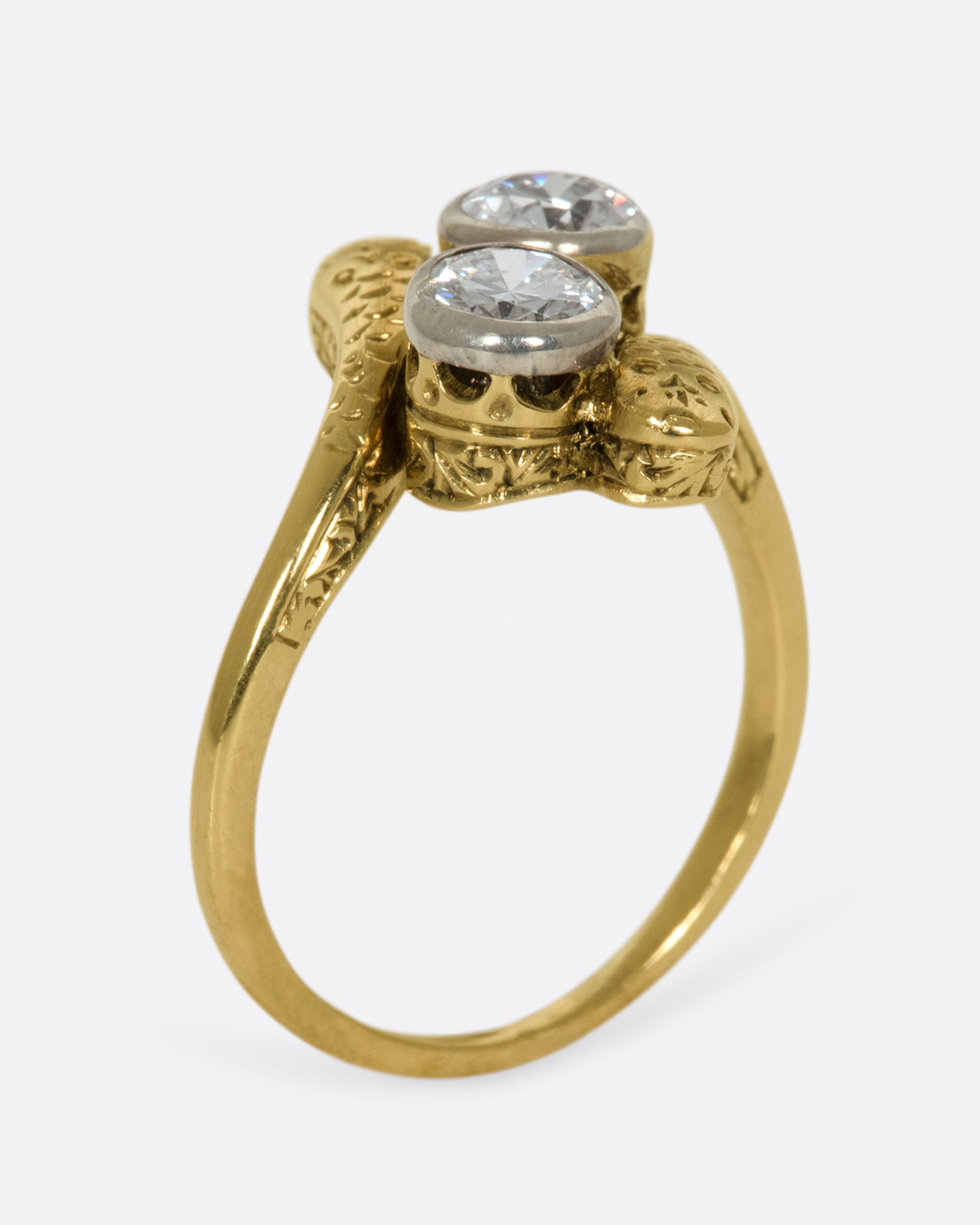 A vintage, Russian ring with two large old European cut diamonds at its center.