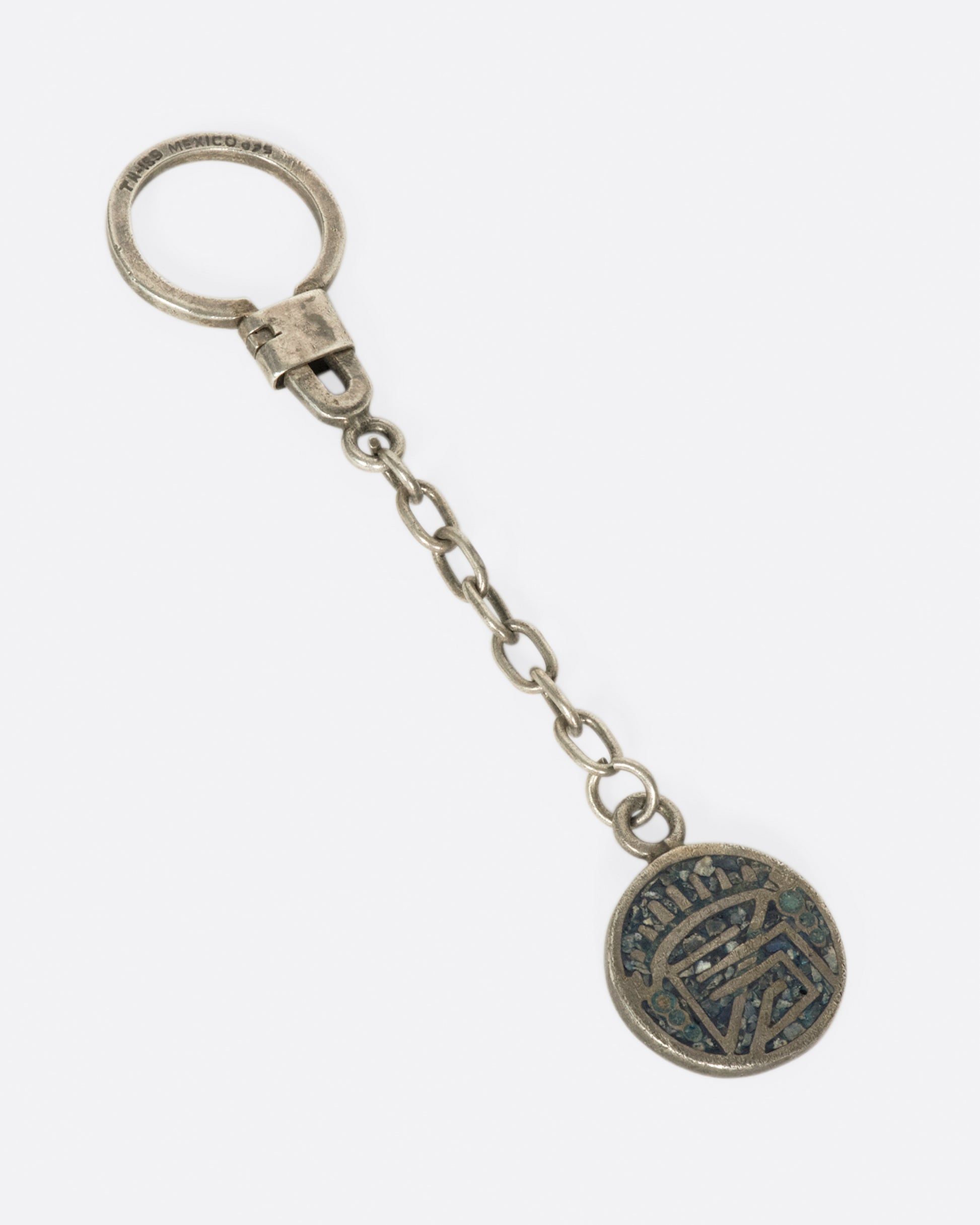 A vintage sterling silver keyring with sodalite inlay, symobolizing wisdom.