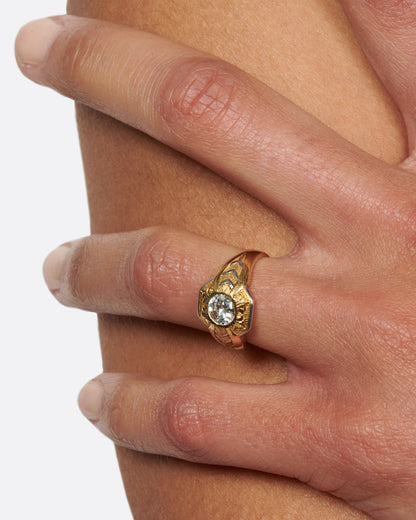 Vintage gold and platinum diamond ring worn on a hand