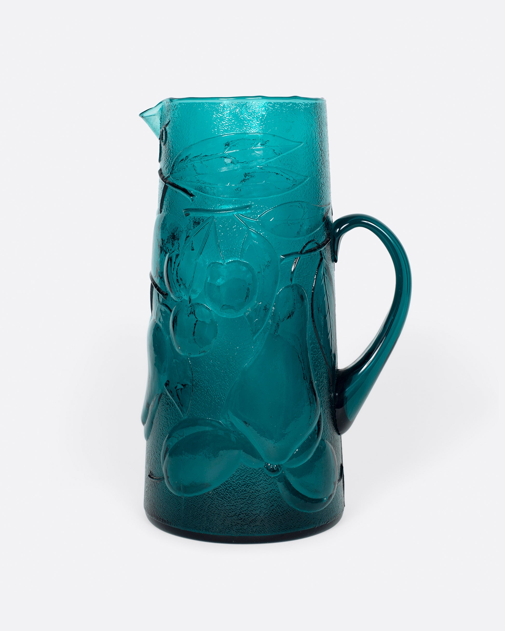 This teal glass set has a subtle fruity texture.