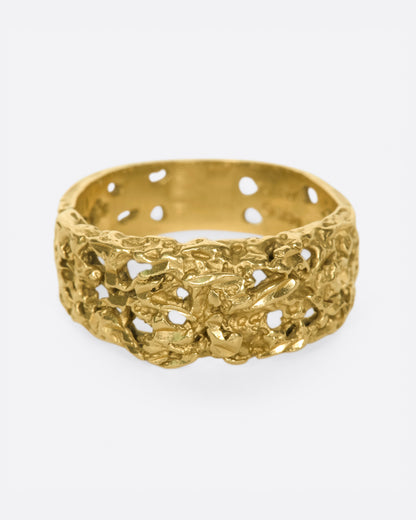Vintage yellow gold molten textured band, front view of the pierced openings