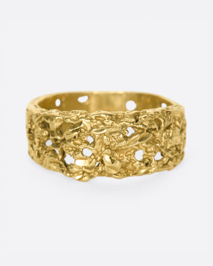 Vintage band in 14k yellow gold, a wide ring with a molten, pierced organic texture