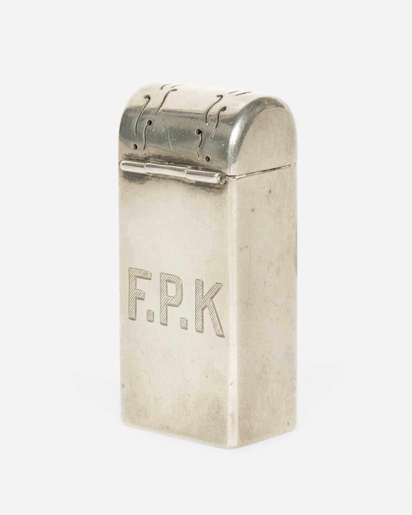 A vintage monogrammed toothbrush holder from Tiffany & Co. A one-of-a-kind gift for your favorite F.P.K.