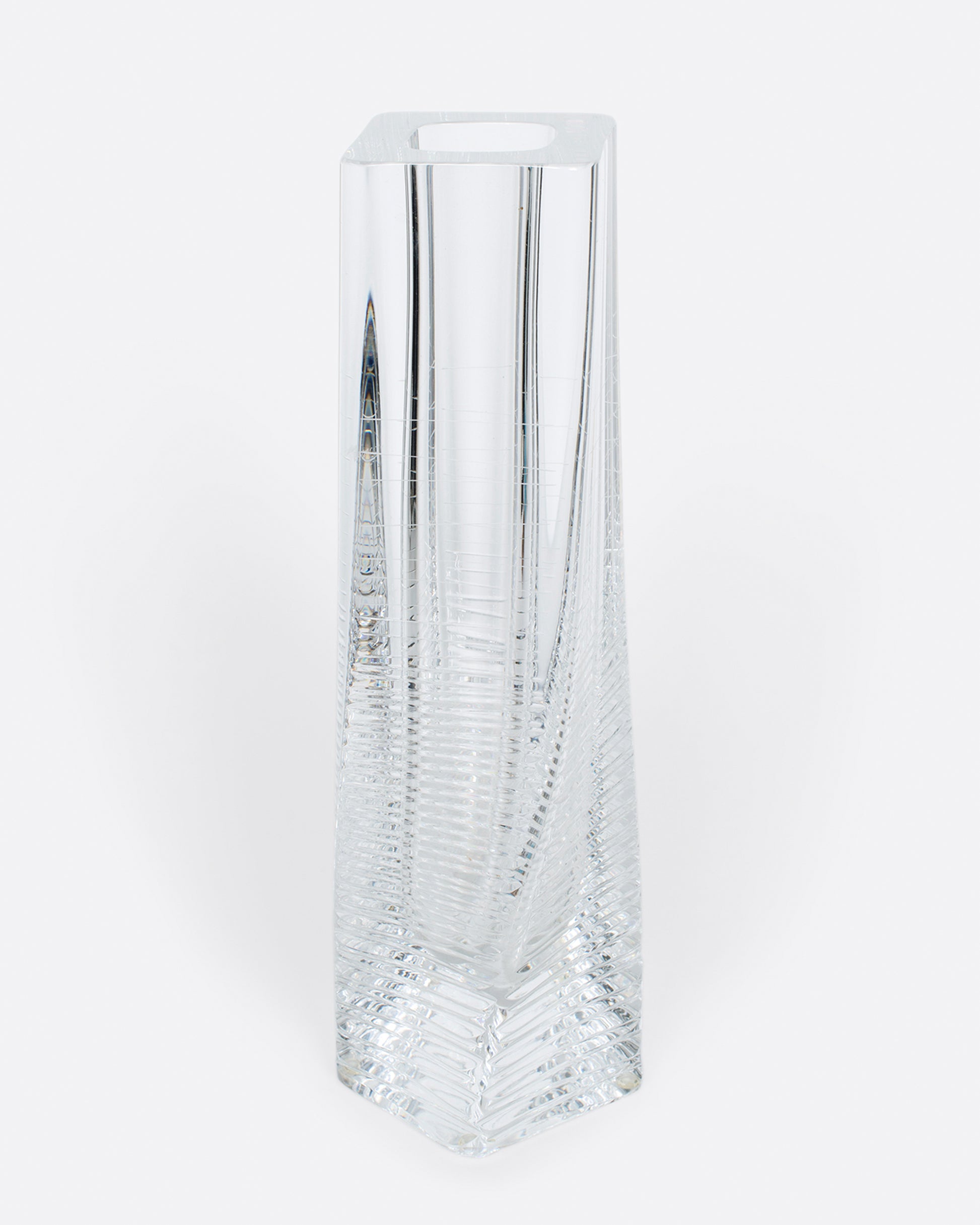 A fantastic, heavy clear glass textured vase. The vase itself is subtly twisted and has glorious rainbows throughout. A magical piece to put in a sunny spot and a Lori favorite!