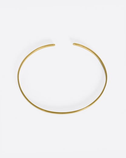 Vintage yellow gold narrow cuff bracelet, top view showing the oval shape