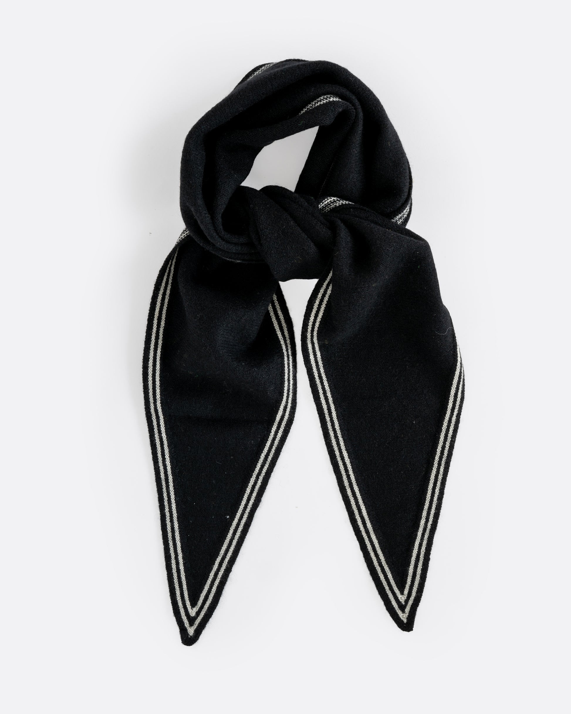 A cashmere black neck scarf with stripy white edges, shown tied from the front.