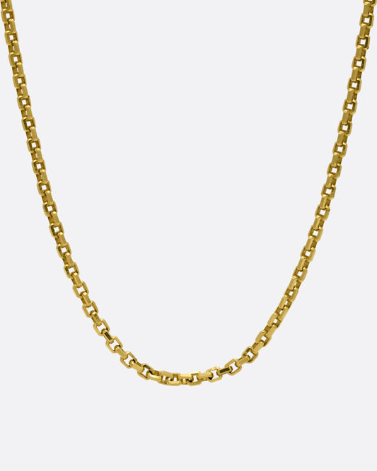 A yellow gold square link necklace, shown from the front.