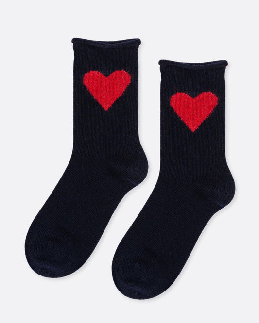 A pair of black socks with a single red heart on the ankle. Shown from the side.