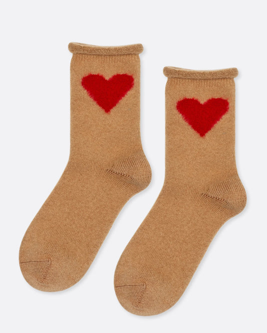 A pair of camel colored socks with red hearts on the ankles, shown from the side.