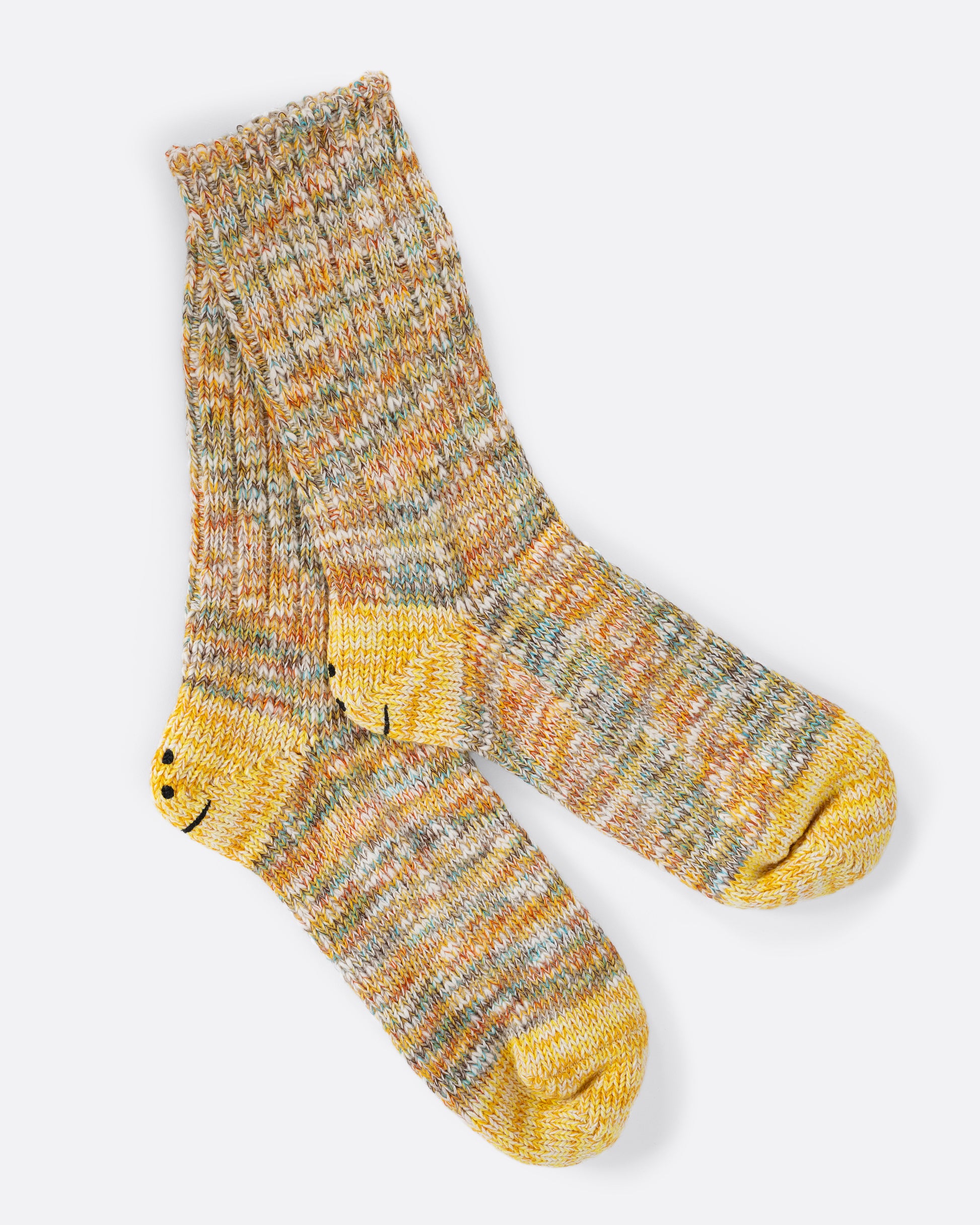 A pair of yellow melange ribbed socks with yellow smilie heels.