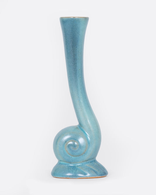 A light blue bud vase with a swirl at the base. Shown from the front.