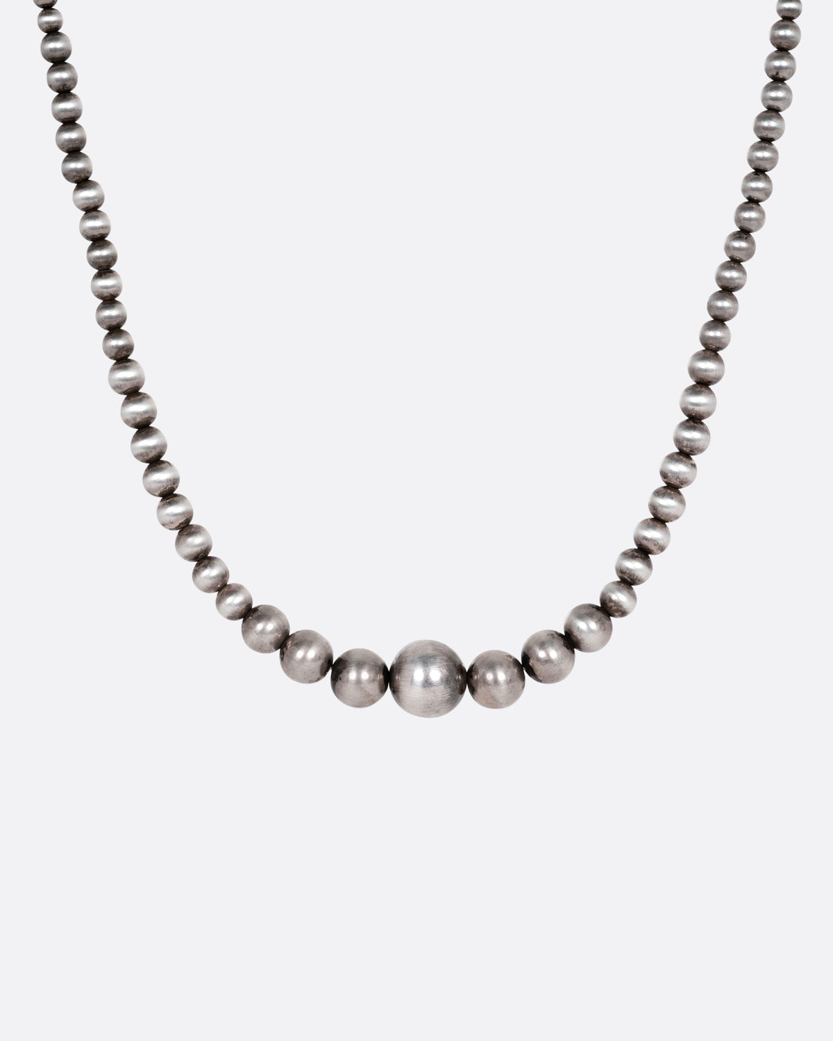 Vintage necklace in sterling silver, graduated round silver beads getting larger toward the center