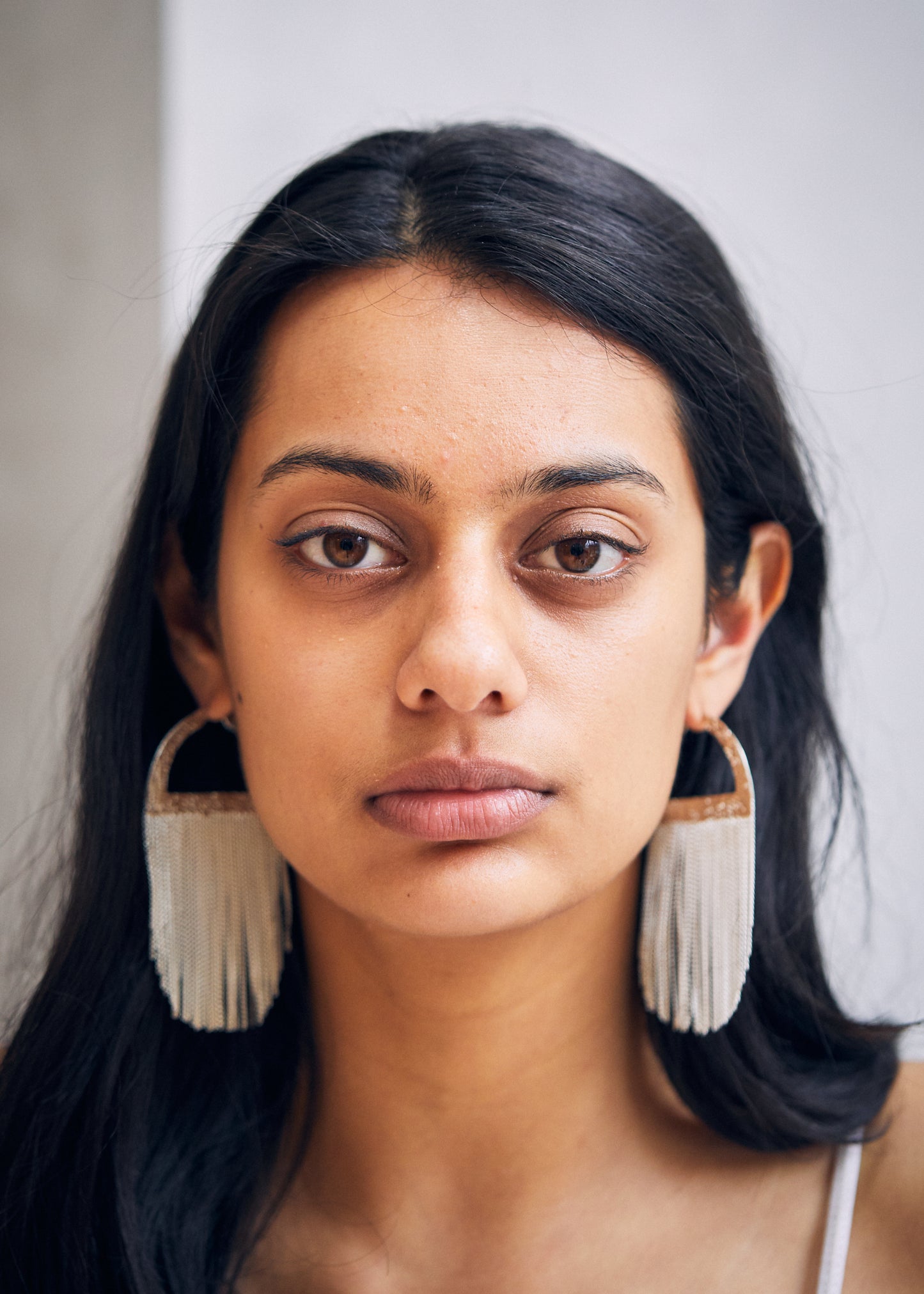 womans ears with hoops in them