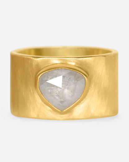 A wide, matte yellow gold hammered band with a rose cut gray diamond, shown from the front.