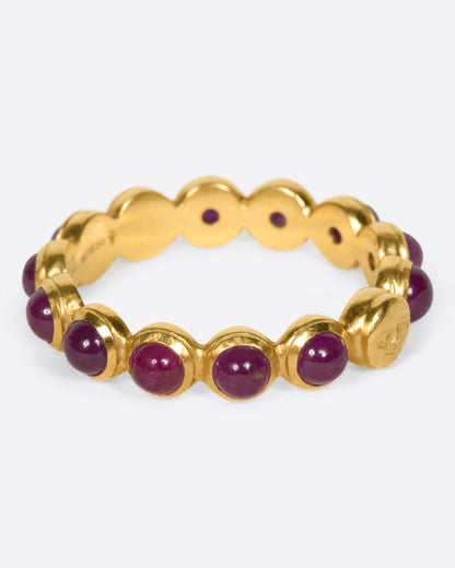 Yellow gold ruby band with moon face, back view of the band showing the bezels from inside