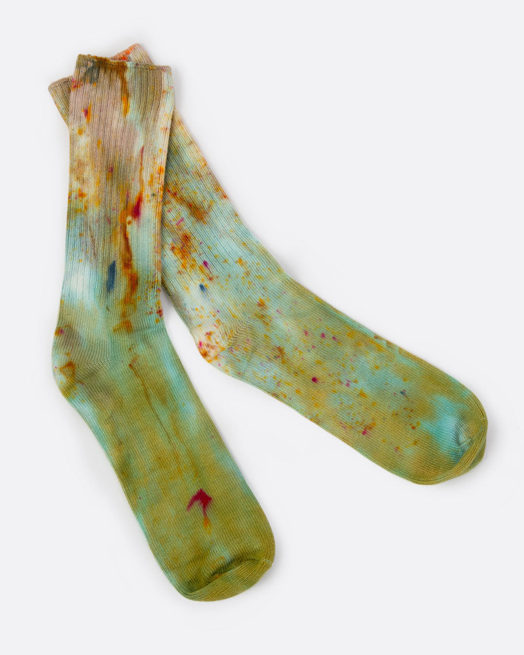 Hand dyed green socks, shown laying flat.