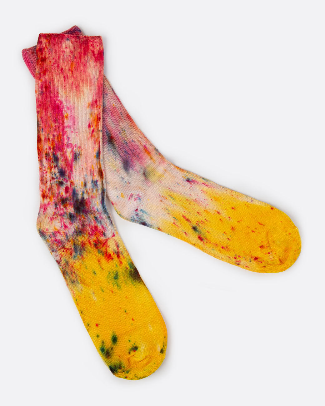 Hand dyed pink and yellow socks, shown laying flat.
