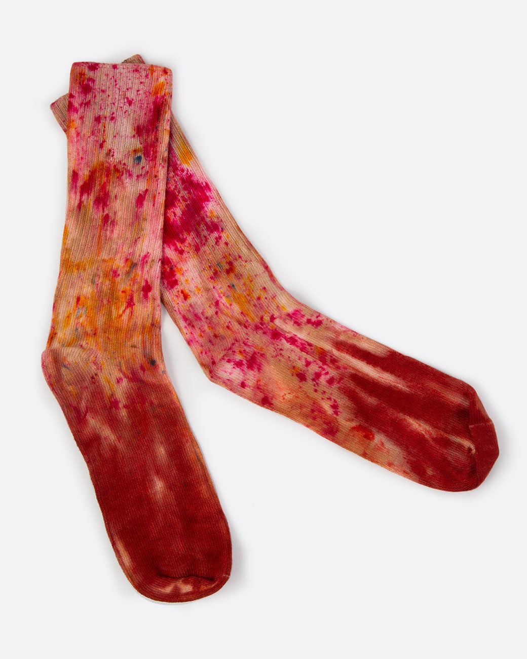 Hand dyed red socks, shown laying flat.