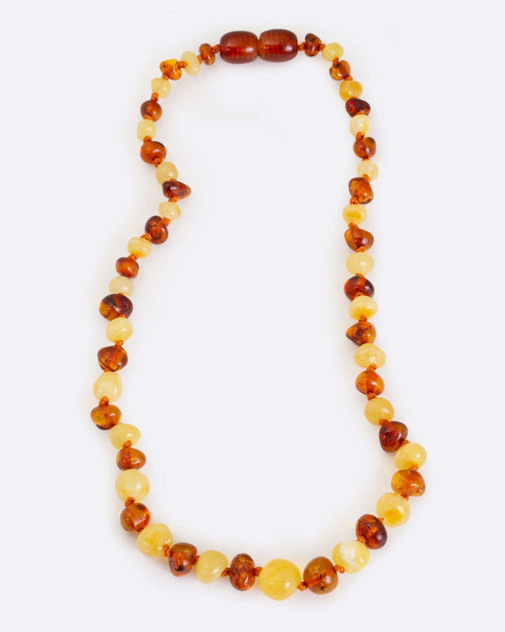 Multicolor amber teething necklace, shown laying flat.