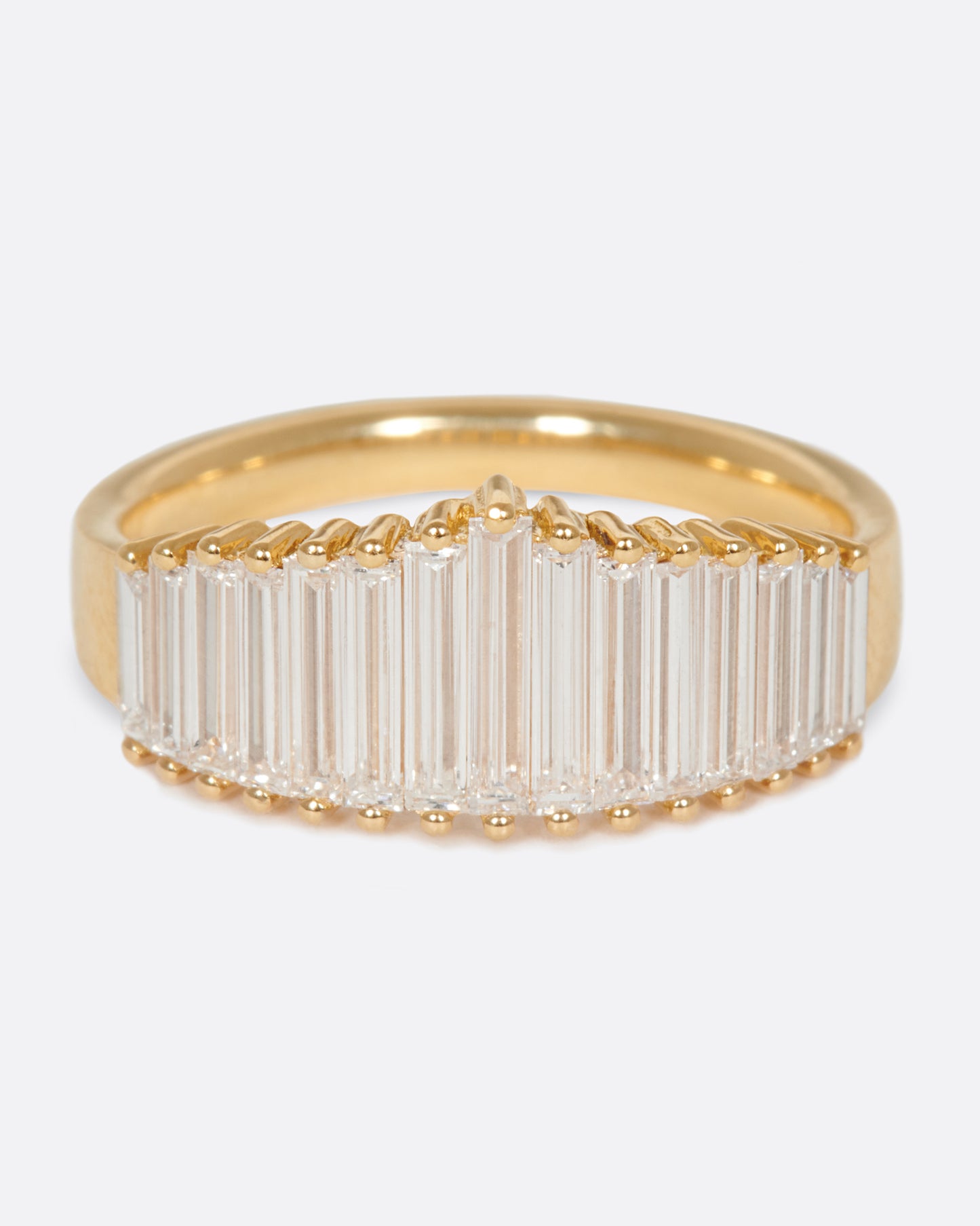 A wide crown ring of baguette diamonds, just as magnificent on its own as it is stacked.