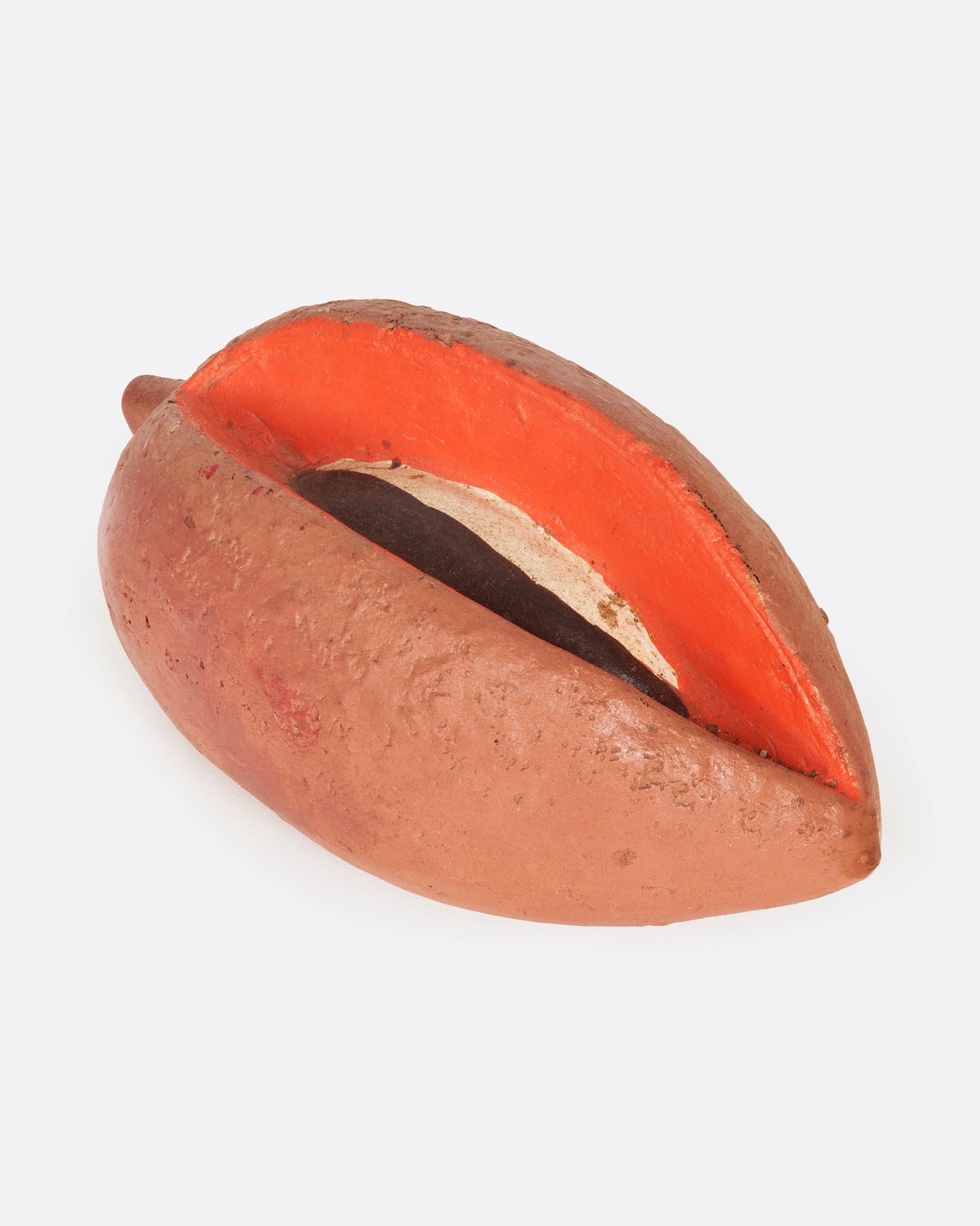 A vintage handmade mamey bank from 1940's Mexico.