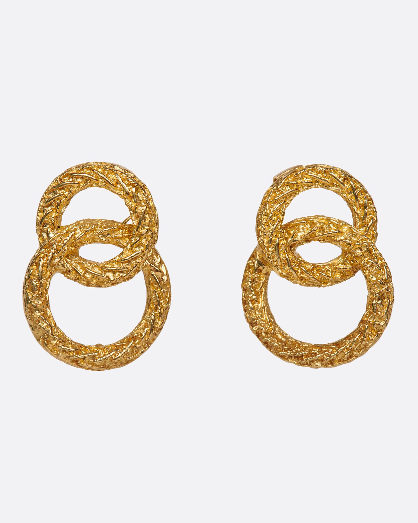 A pair of textured double-circle stud earrings for an impactful look.