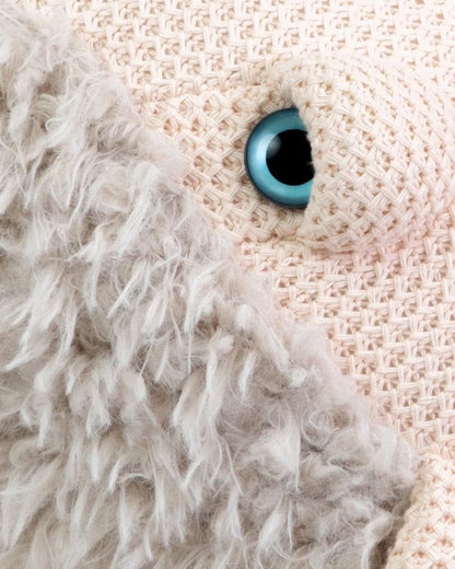 Pink and gray whale plush toy, close view of the eye and fur