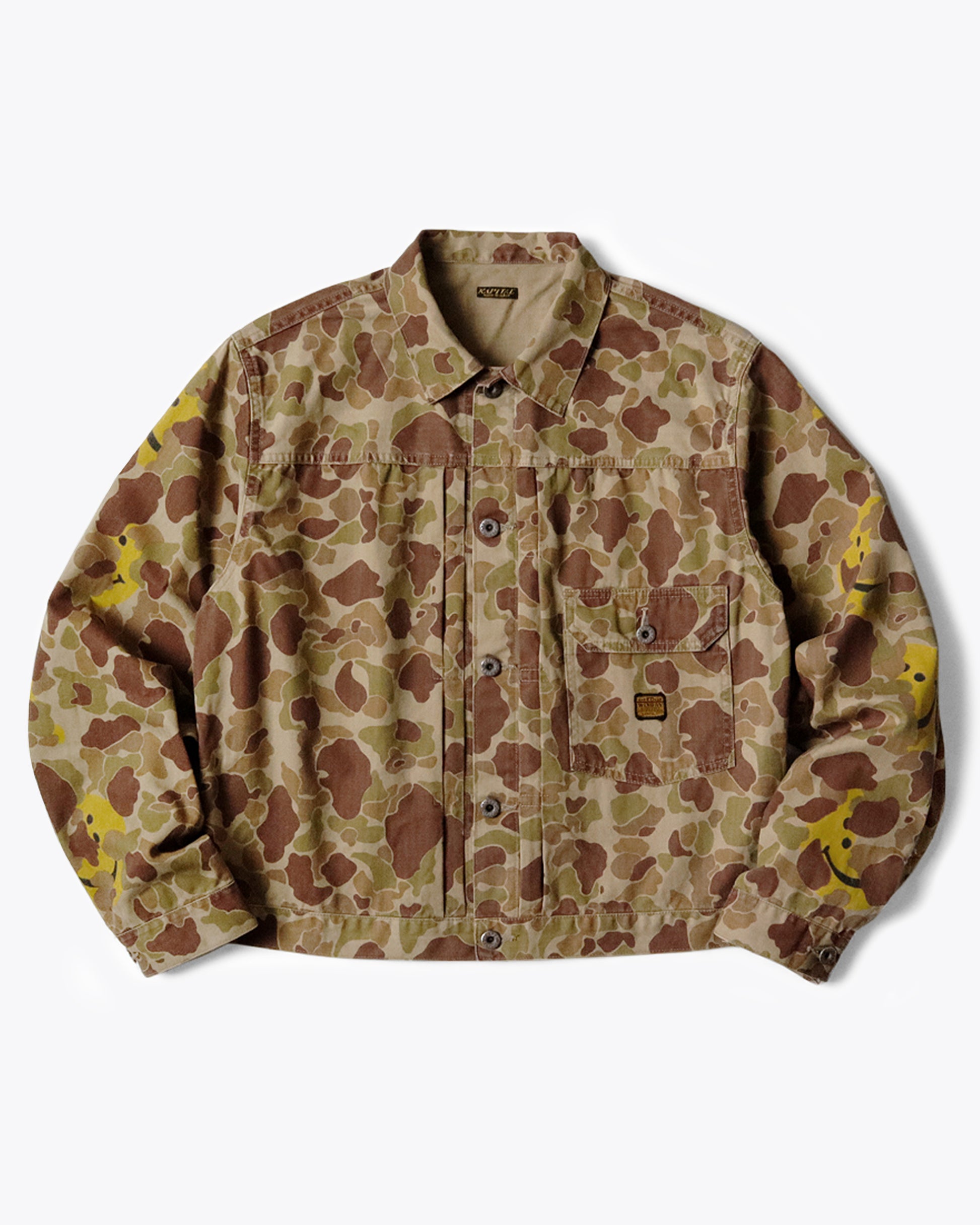 A military-like camouflage 1st jacket with smiley faces peeking out.