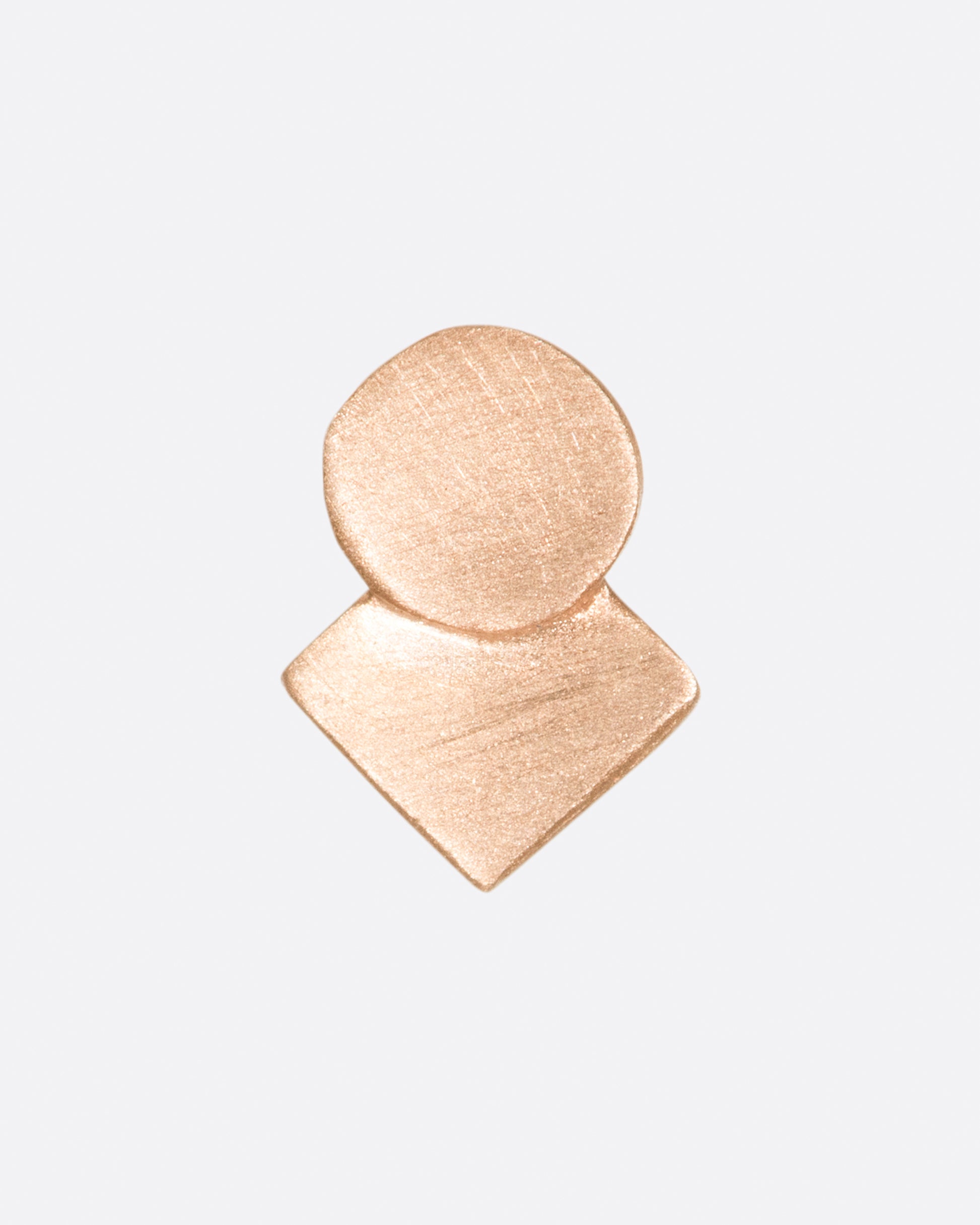 A square stud earring with overlapping circle and matte finish.