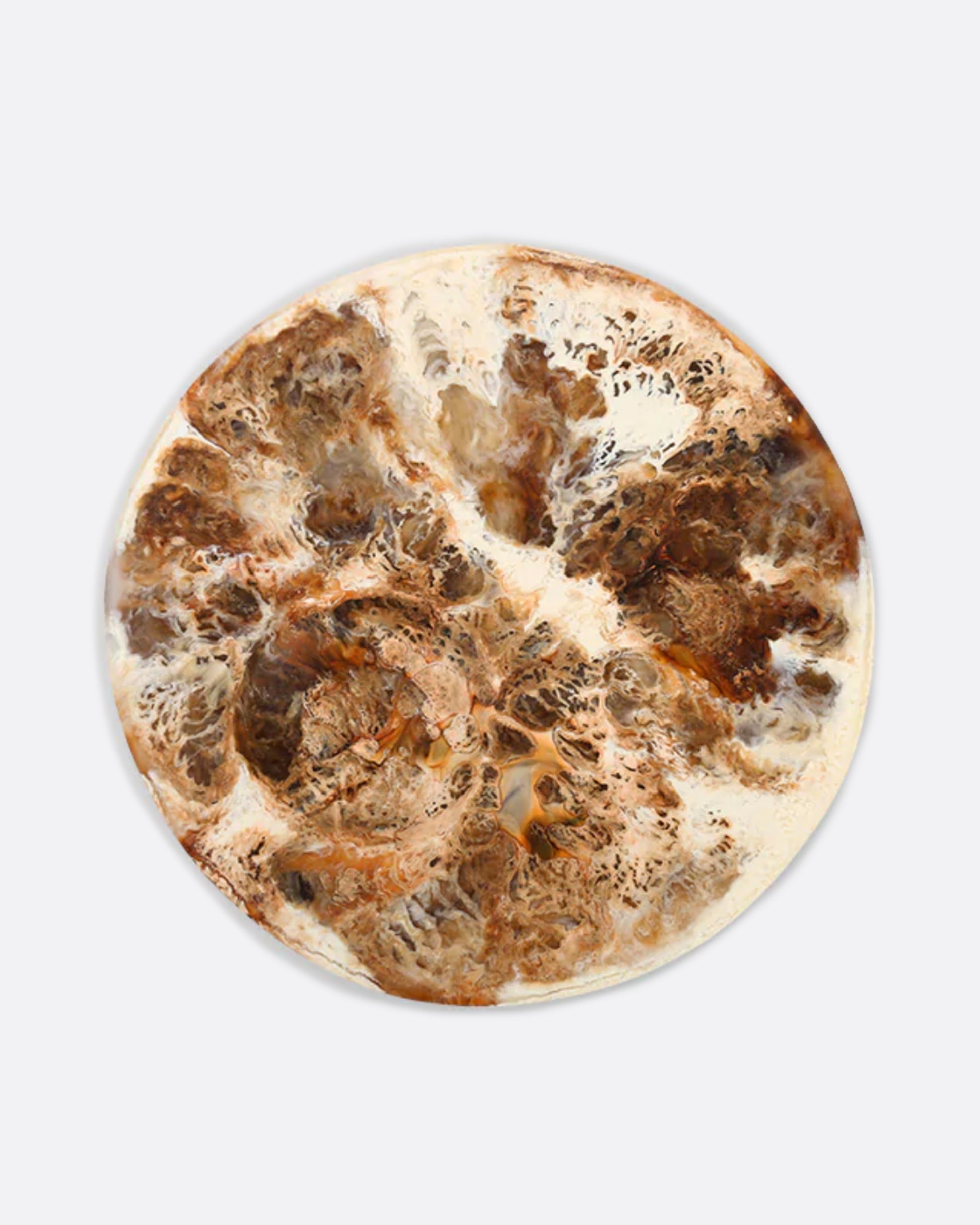 A round brown and white resin platter with a round indentation, shown from above.
