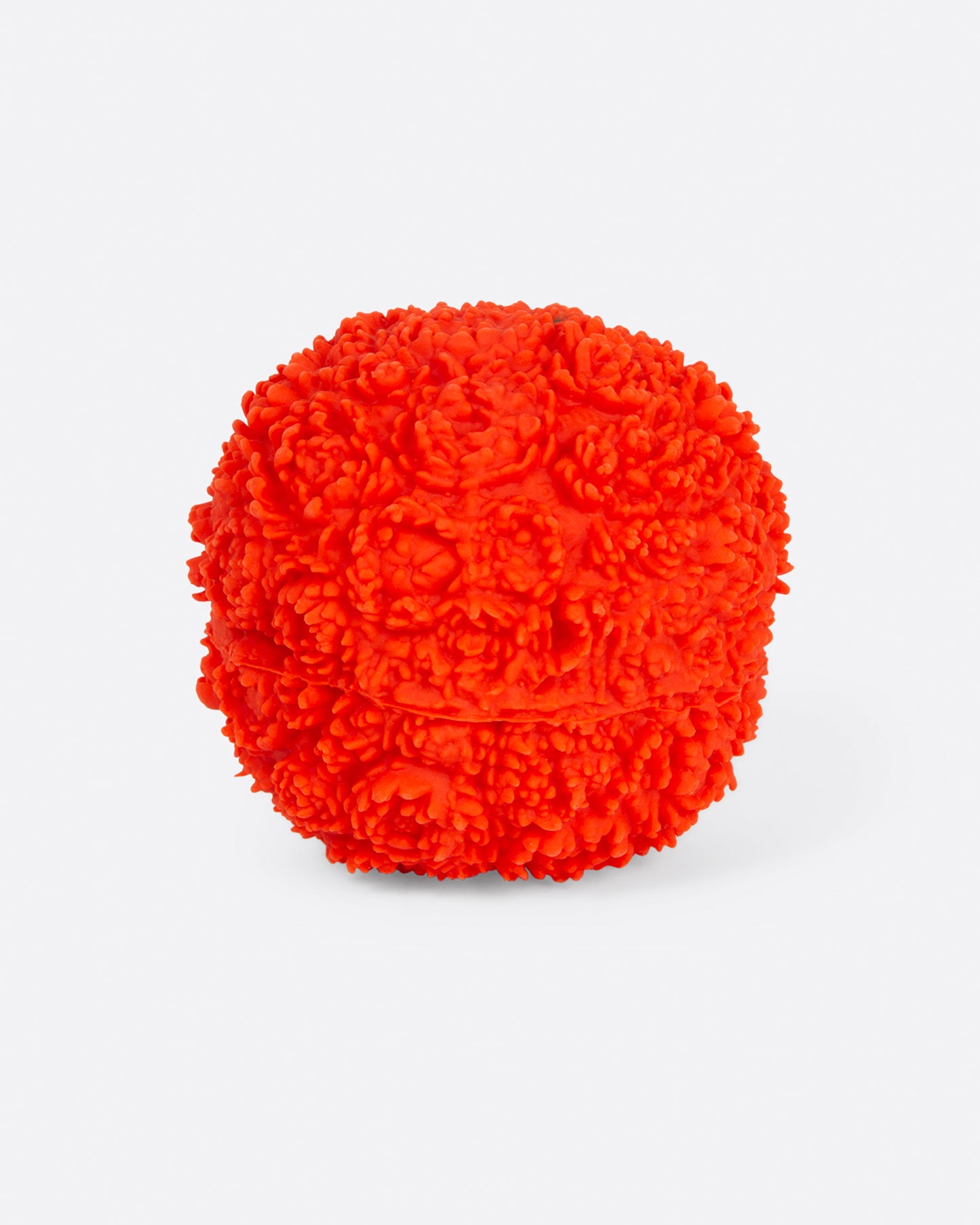 Front view of red flower ball dog toy