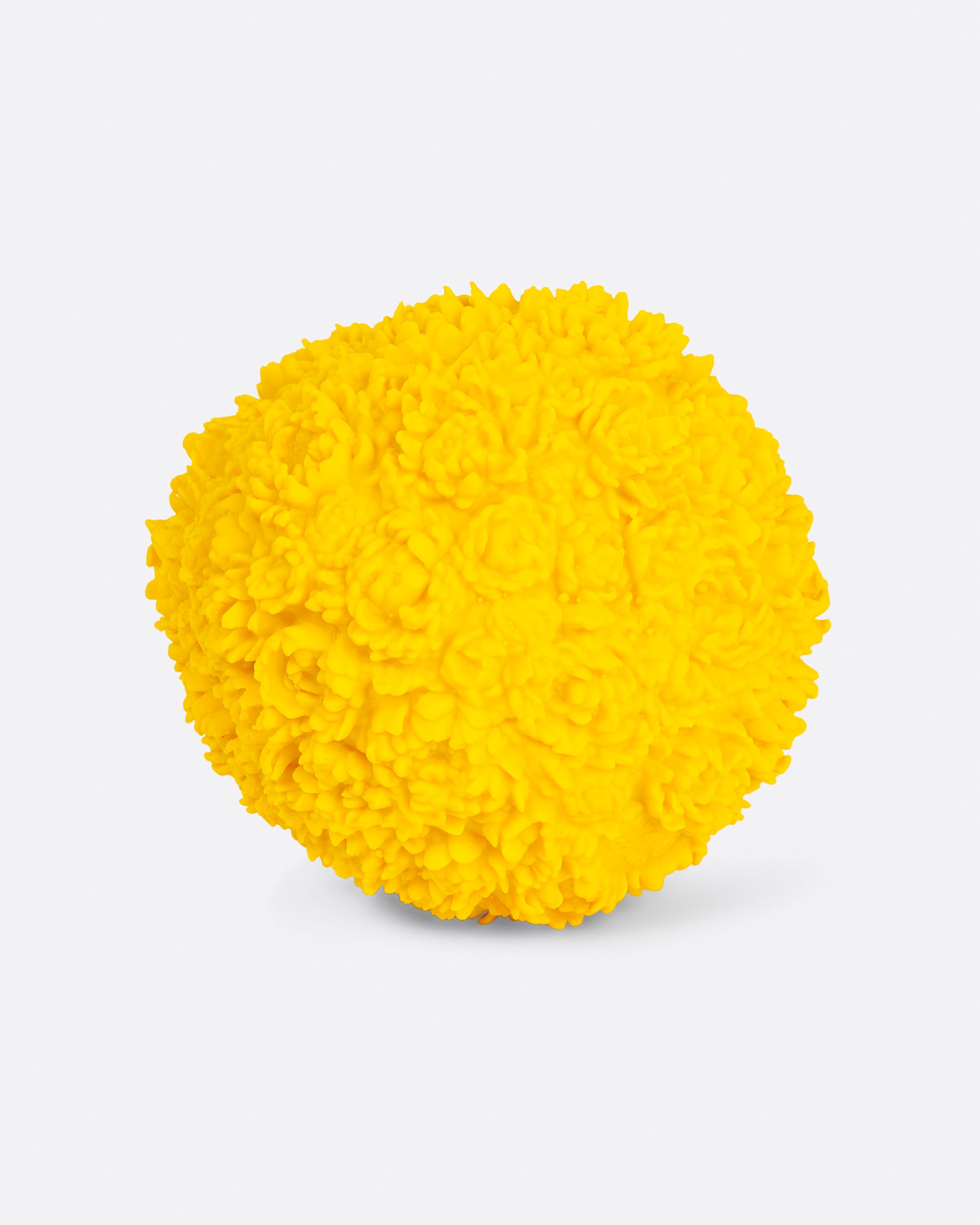 Front view of yellow flower ball dog toy