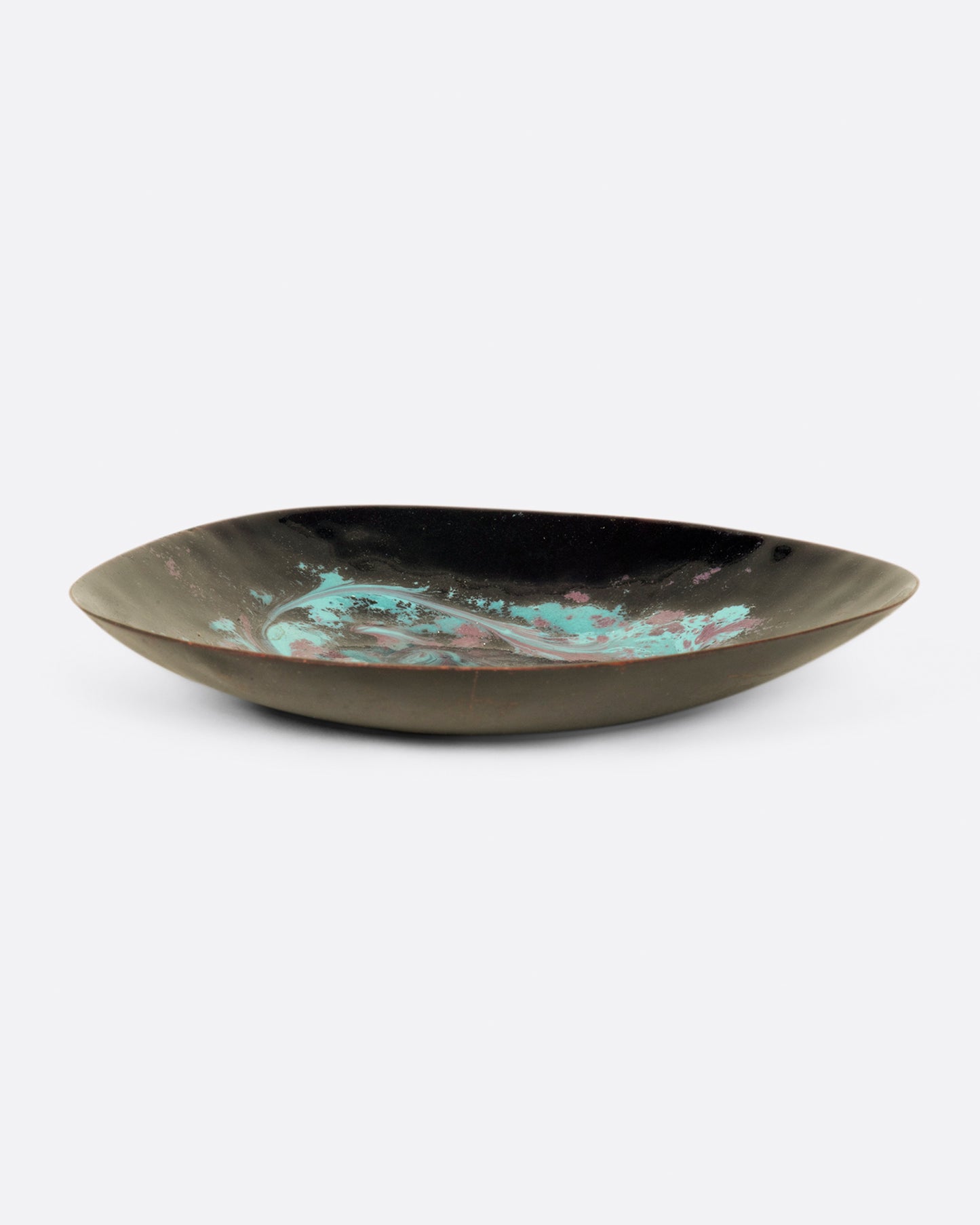 A metal dish, tapered at one side, coated in swirled pink and blue enamel.