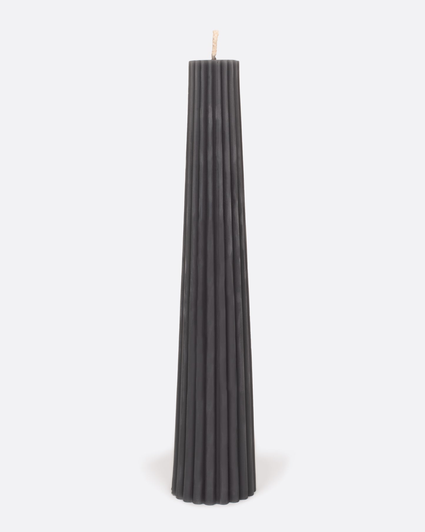 Charcoal gray fluted pillar candle, shown standing.
