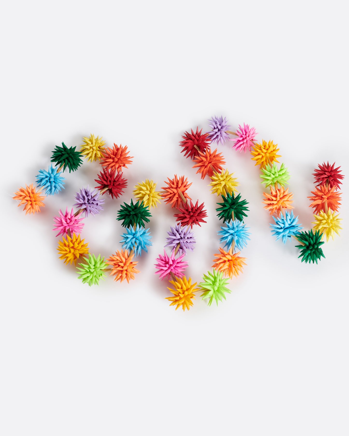 A multicolor paper starburst garland, shown from above.