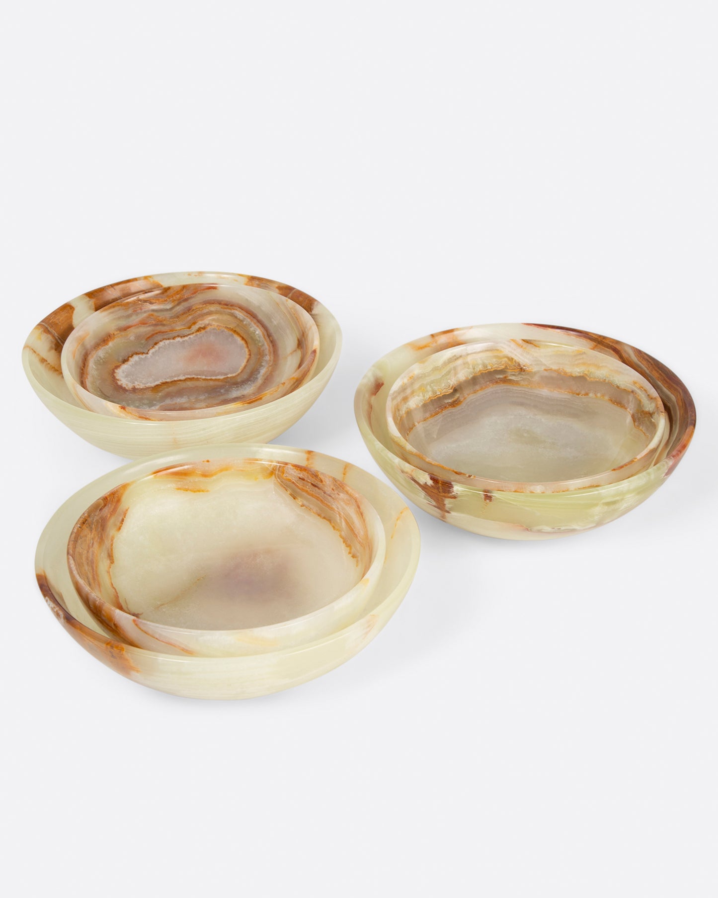 Three pairs of small and medium polished green onyx bowls, shown from the side.