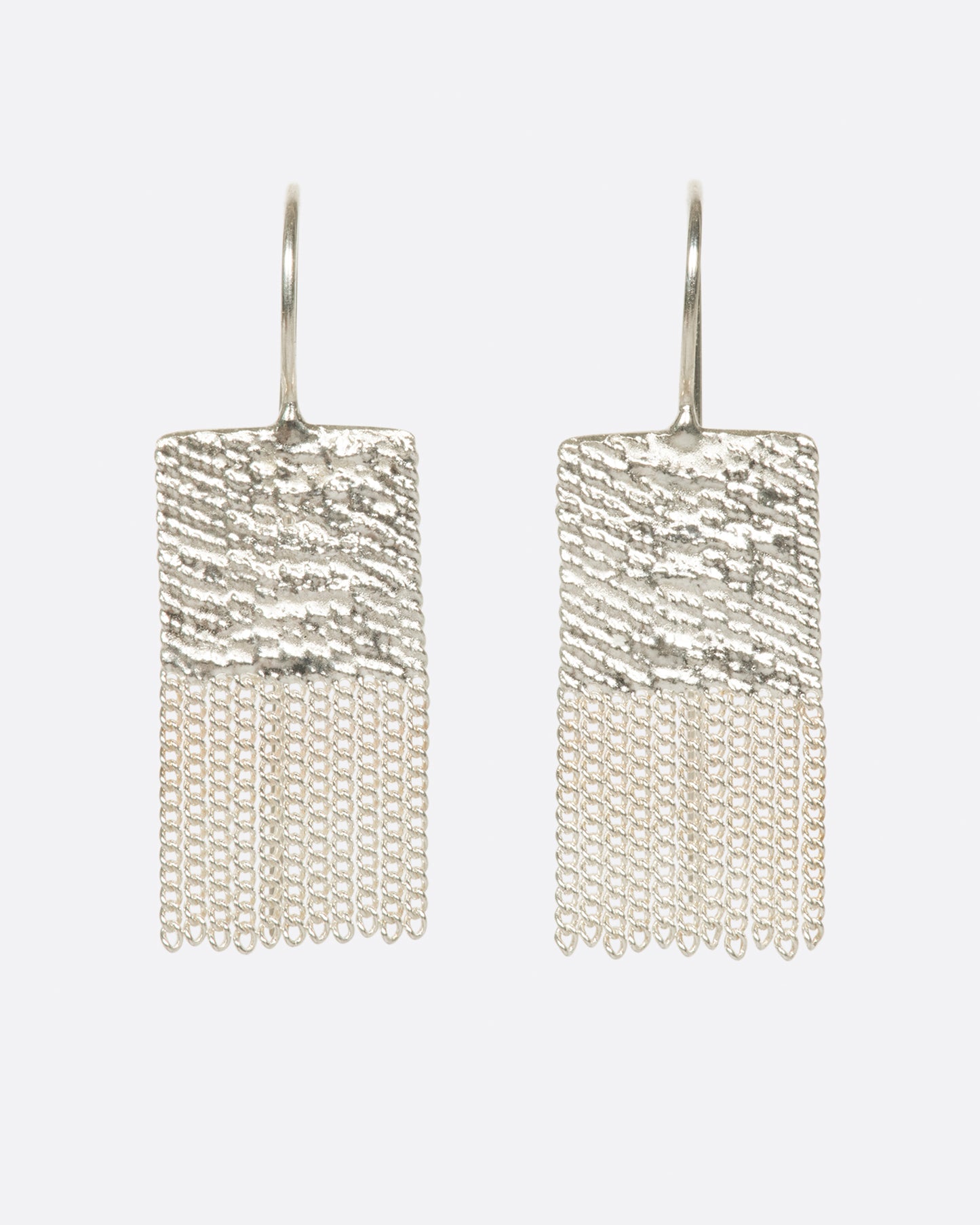  two silver earrings that are two squares stacked. the top square is solid and the bottom one is chains. there are silver hooks attached to the top.