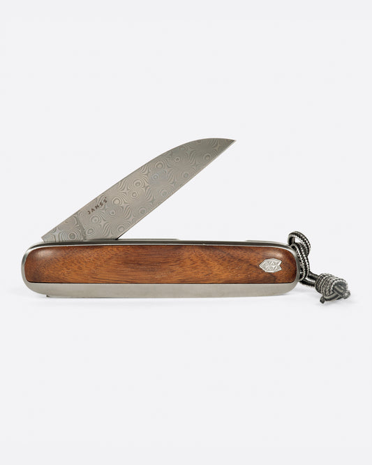A pocket knife with a rosewood handle and damasteel blade.