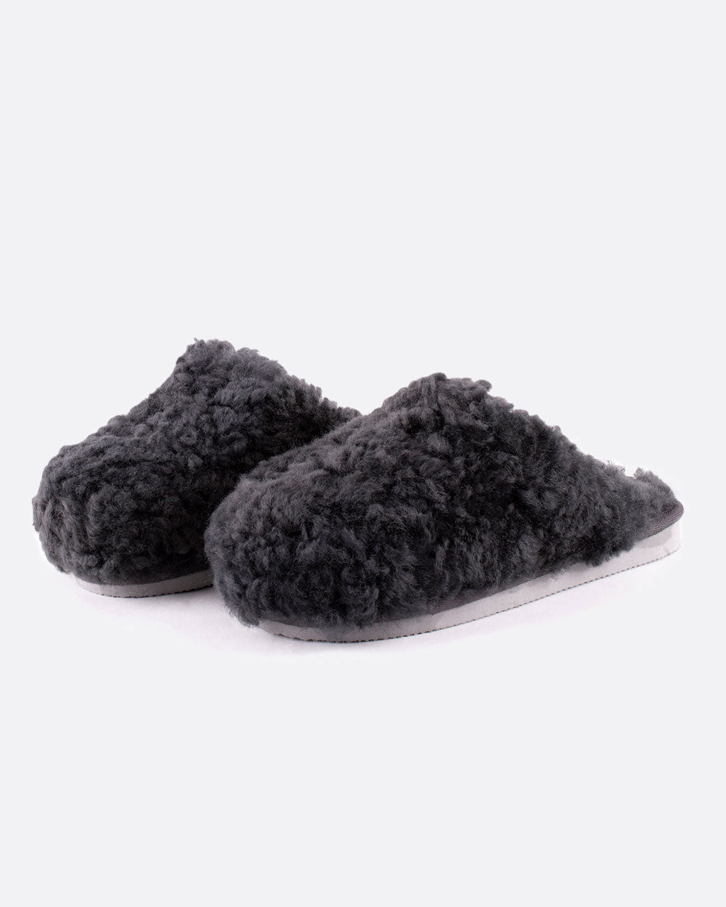 Jenny sheepskin slippers in charcoal gray, shown from the side
