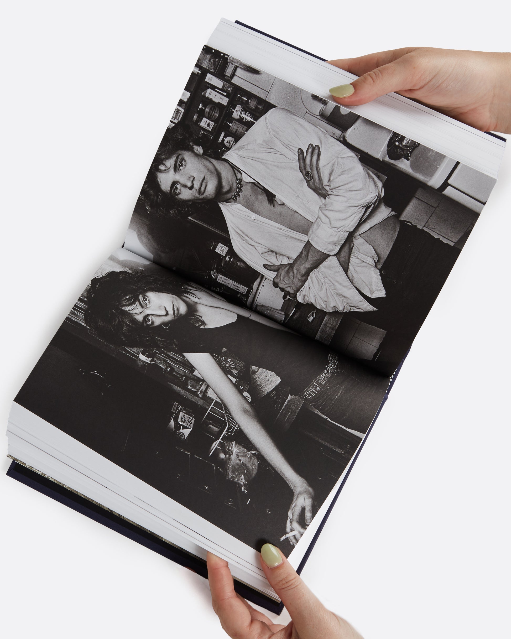 Patti Smith's award winning memoir with never-before-seen photographs, shown open.