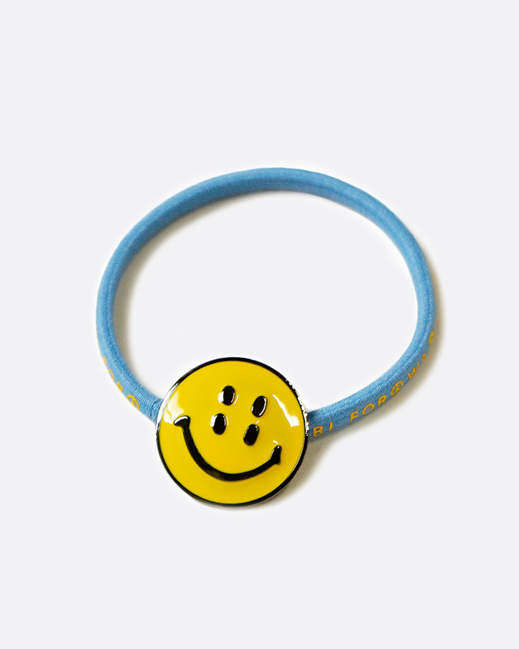 Kapital smiley hair tie in light blue, shown from above.