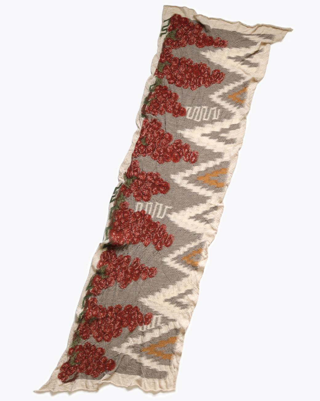 Kapital navajo vineyard scarf in red, shown laying flat.