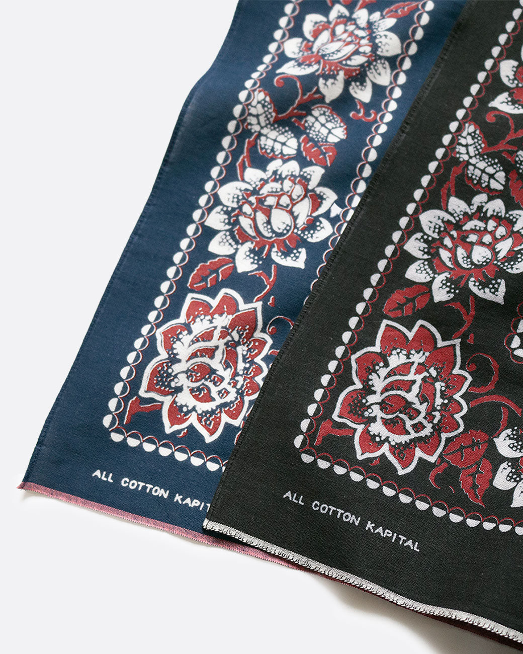 Close up of Kapital rockwell flower bandanas in navy blue and black.
