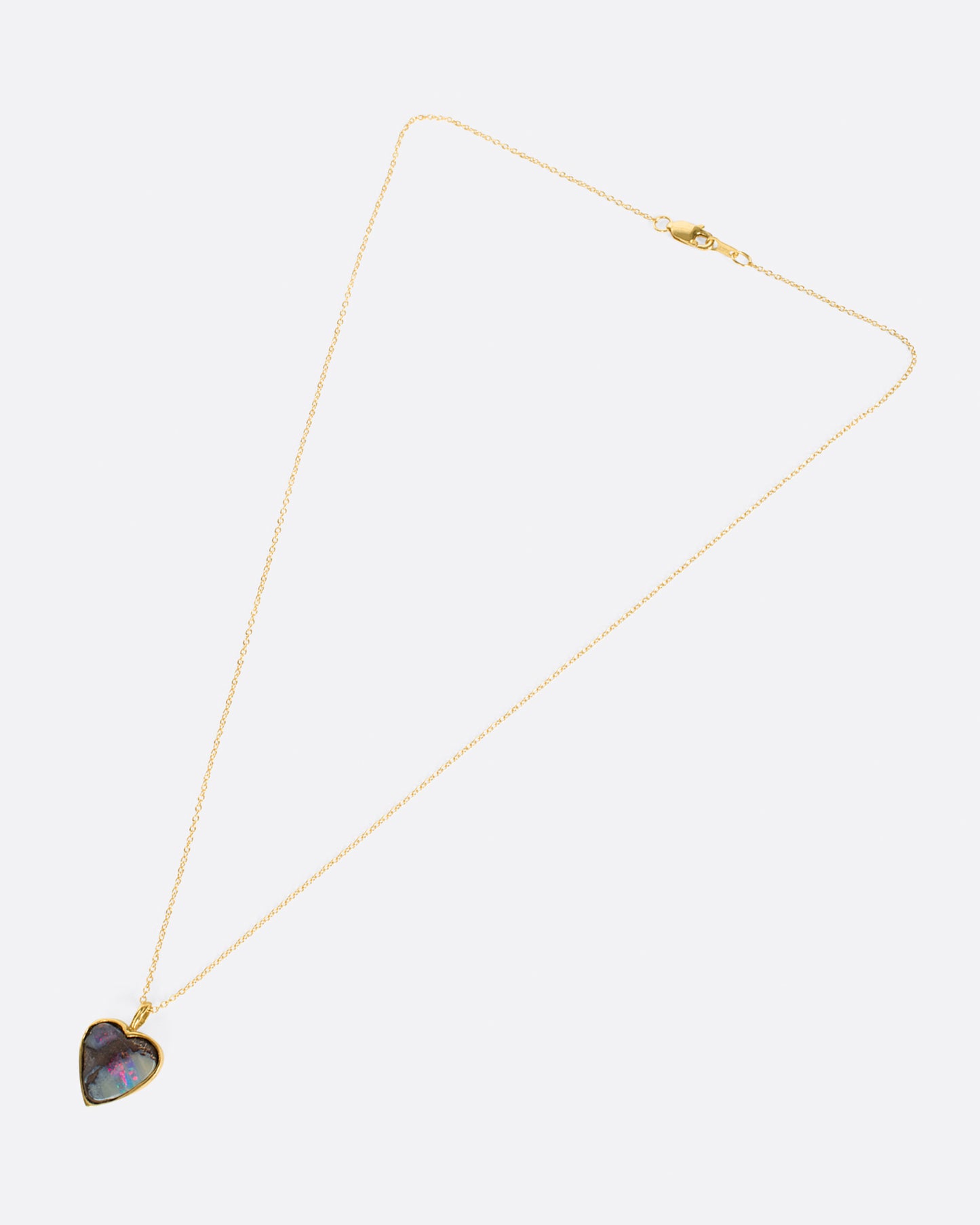 A heart shaped Australian opal pendant with loads of flash.