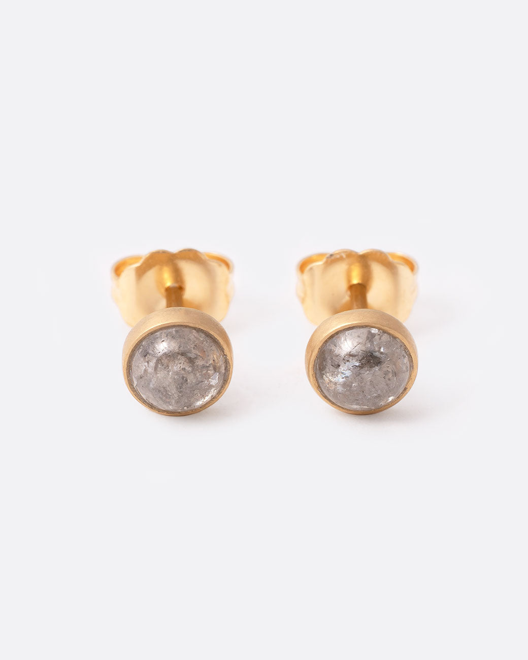 18k yellow gold stud earrings with gray diamond cabochons by Lola Brooks, shown from the front.